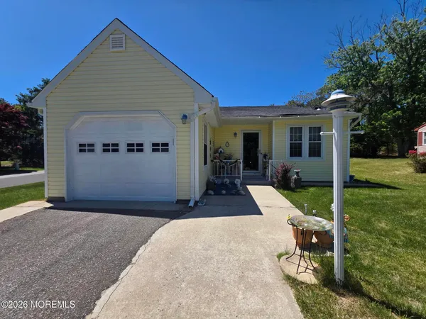 a front view of a house with yard