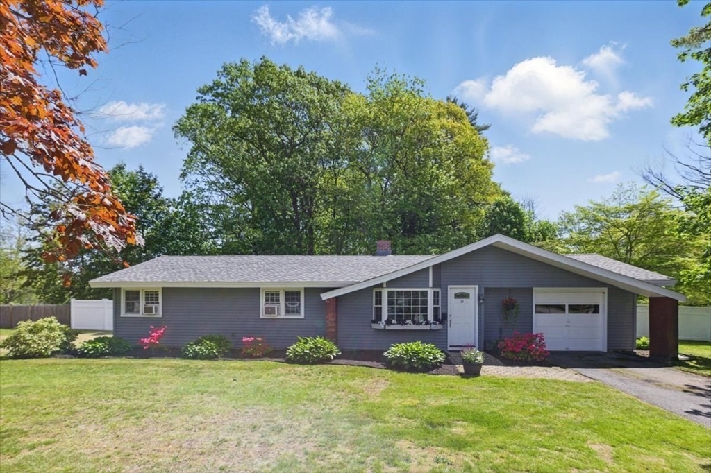 15 Temi Road Beverly, MA 01915 - Photo 1 of 41 a view of a yard in front of a house with plants and large tree