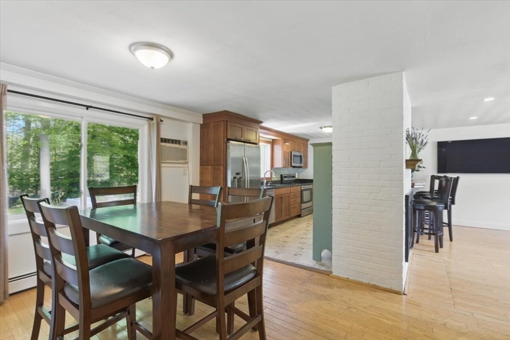 15 Temi Road Beverly, MA 01915 - Photo 19 of 41 a dining room with furniture and wooden floor