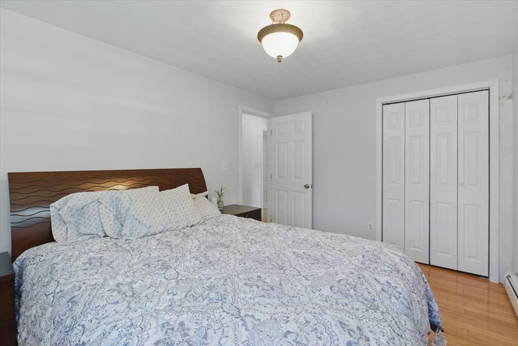15 Temi Road Beverly, MA 01915 - Photo 25 of 41 a bedroom with a bed and cabinets