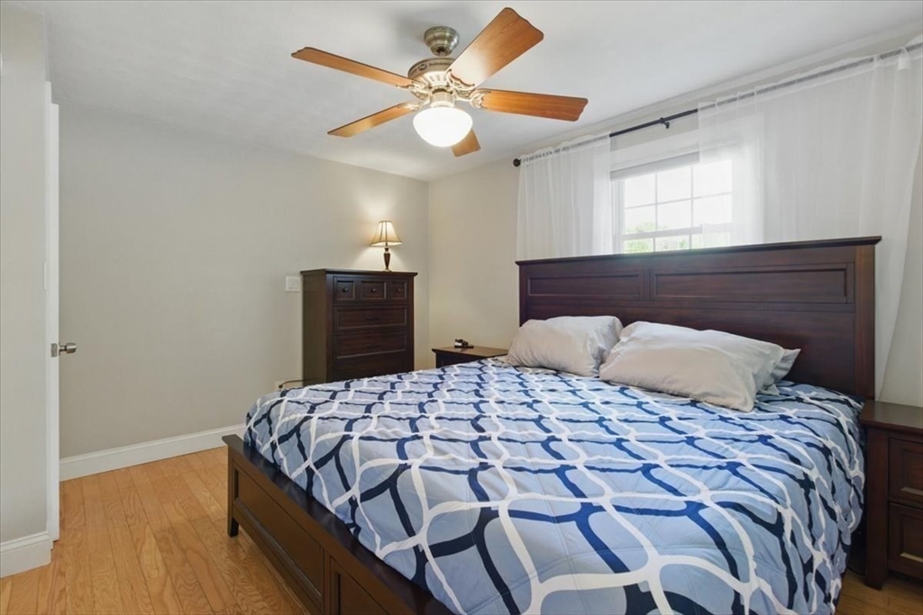 15 Temi Road Beverly, MA 01915 - Photo 32 of 41 a bedroom with a bed and wooden floor