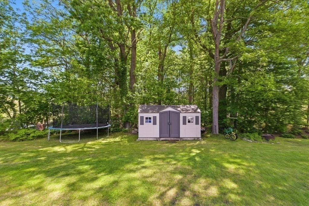 15 Temi Road Beverly, MA 01915 - Photo 37 of 41 a wooden fence with trees in the background