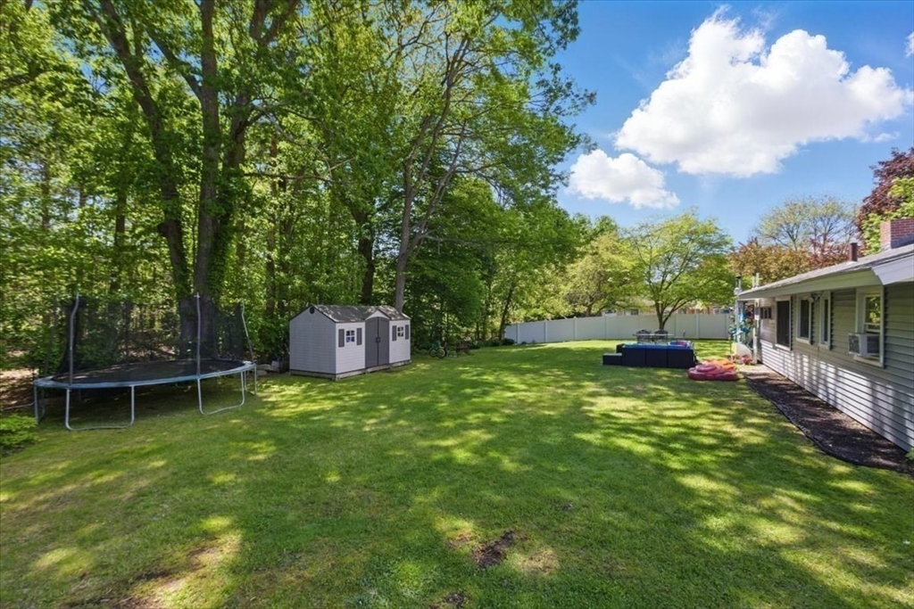 15 Temi Road Beverly, MA 01915 - Photo 39 of 41 a backyard of a house with table and chairs