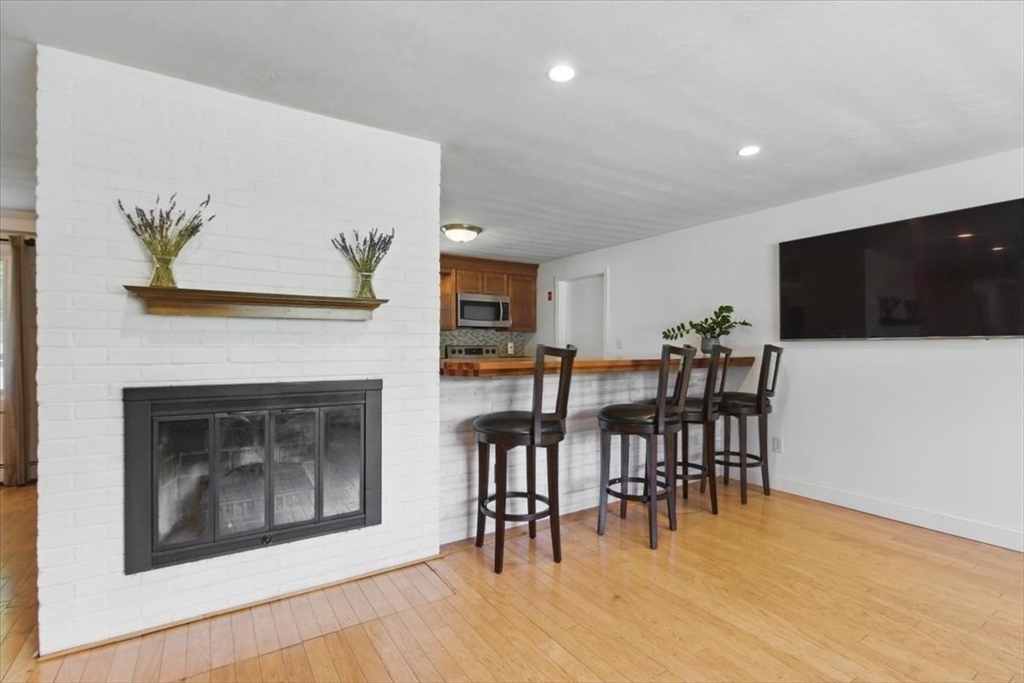 15 Temi Road Beverly, MA 01915 - Photo 4 of 41 a living room with furniture and a flat screen tv