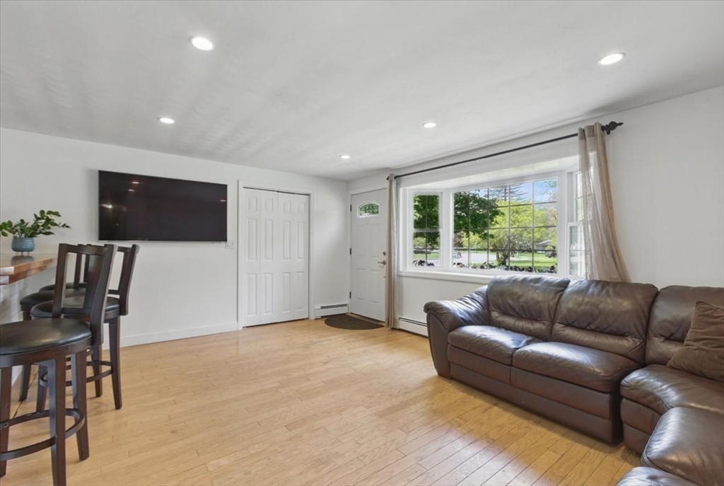 15 Temi Road Beverly, MA 01915 - Photo 5 of 41 a living room with furniture and a flat screen tv