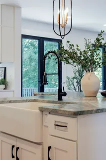 a bathroom with a double vanity sink mirror and toilet