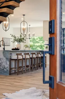 a view of an entryway with wooden floor and door