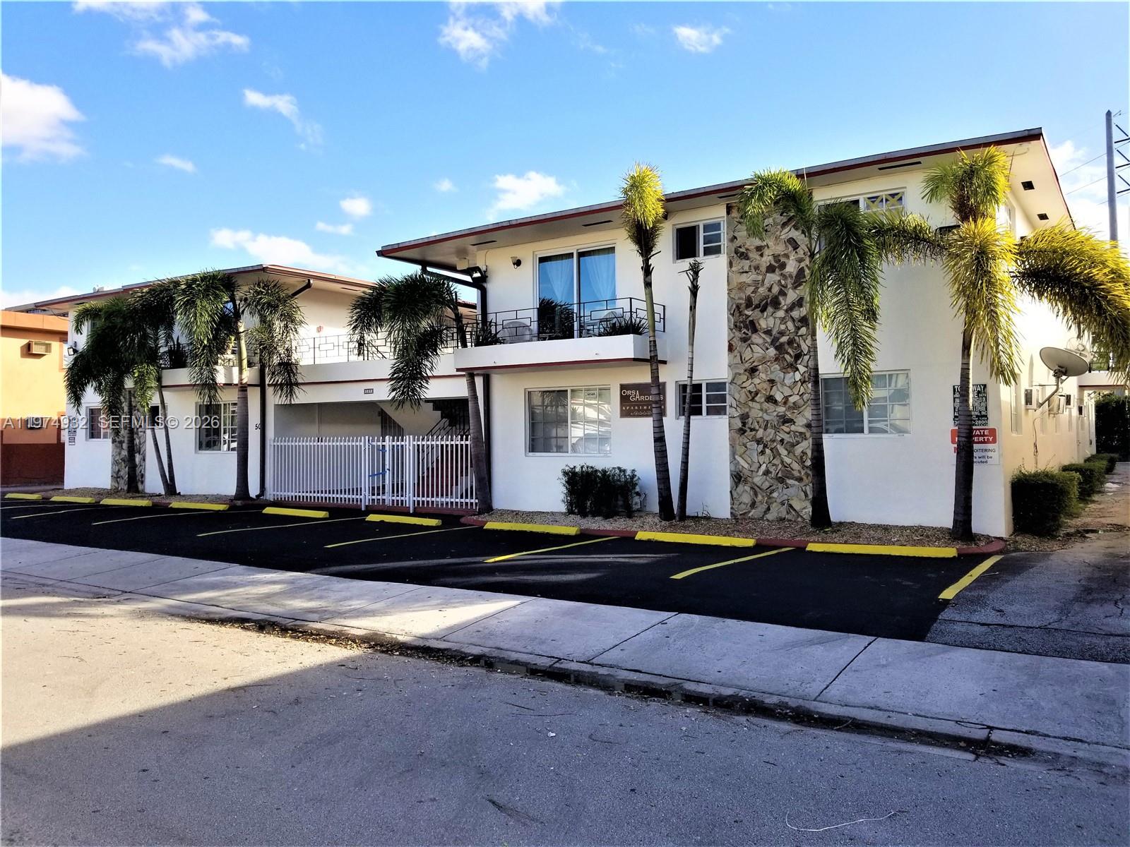 50 West 4th Street, Unit 13 Hialeah, FL 33010 - Photo 1 of 5 a front view of a house with a street