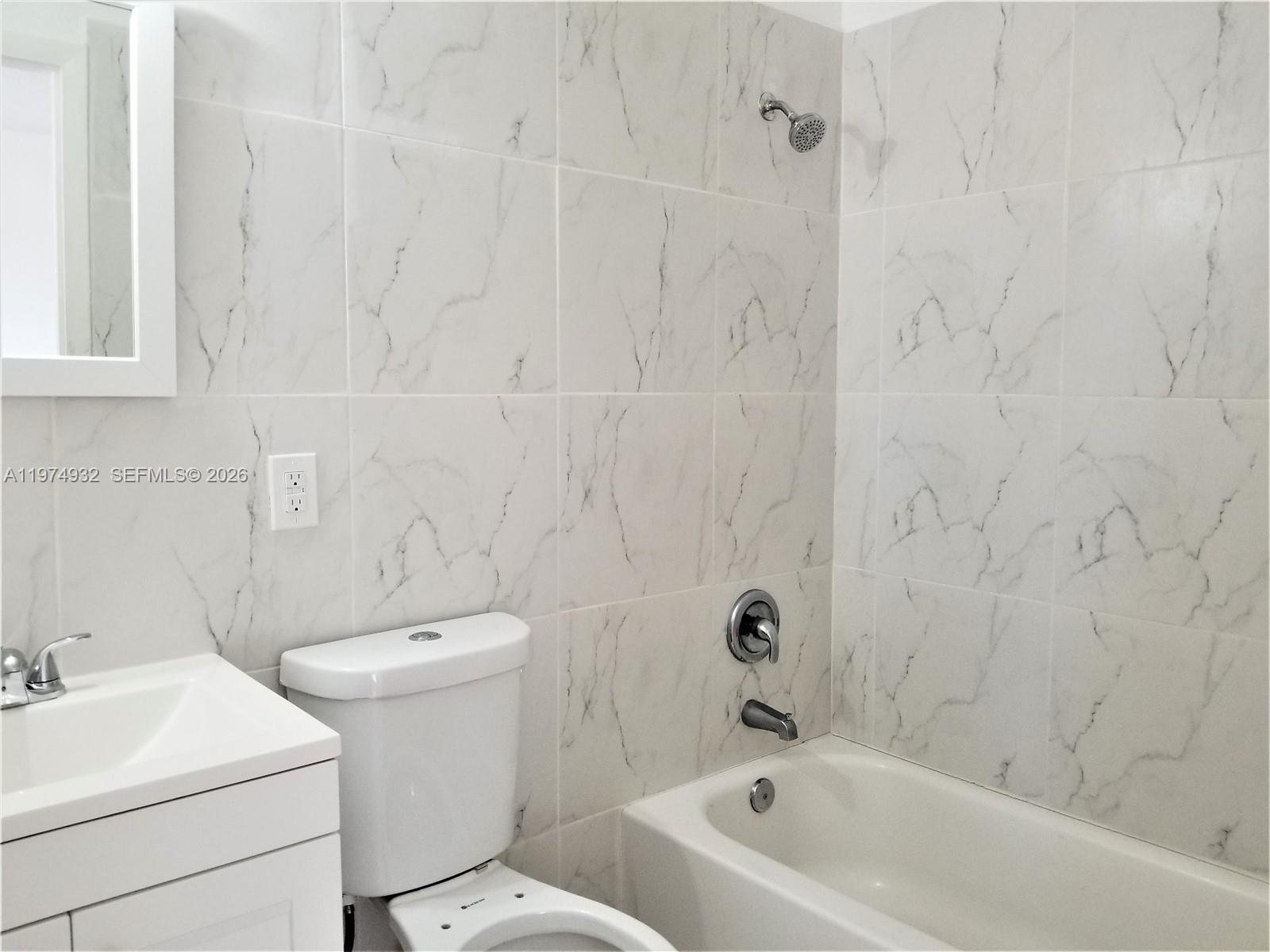 50 West 4th Street, Unit 13 Hialeah, FL 33010 - Photo 3 of 5 a view of a bathroom with a sink and a toilet