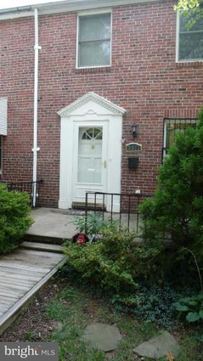 3913 Yolando Road Baltimore, MD 21218 - Photo 1 of 19 a front view of a house with garden