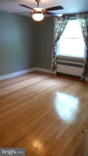 3913 Yolando Road Baltimore, MD 21218 - Photo 14 of 19 a view of room with window and hardwood floor