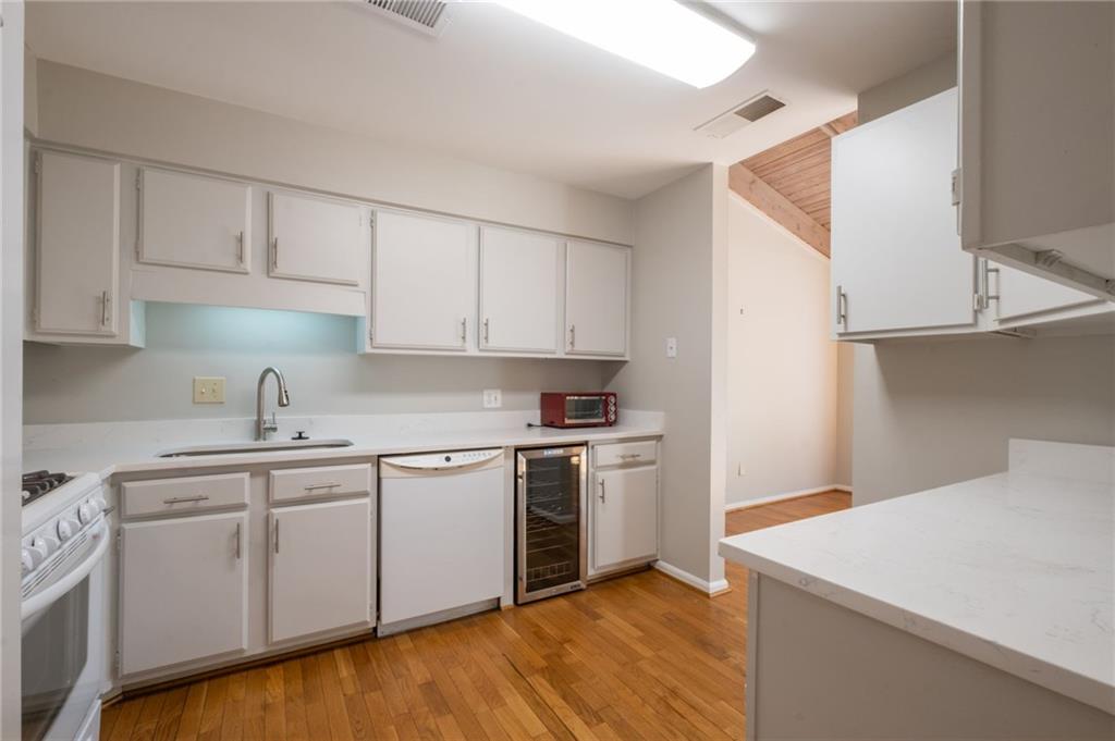 3817 Paces Ferry West Atlanta, GA 30339 - Photo 15 of 34 a kitchen with a sink cabinets and stainless steel appliances