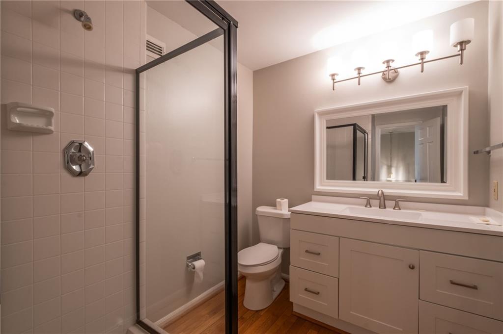 3817 Paces Ferry West Atlanta, GA 30339 - Photo 17 of 34 a bathroom with a toilet a sink and mirror