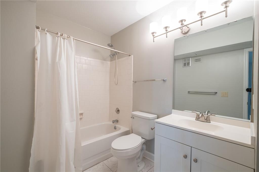 3817 Paces Ferry West Atlanta, GA 30339 - Photo 23 of 34 a bathroom with a sink toilet and shower