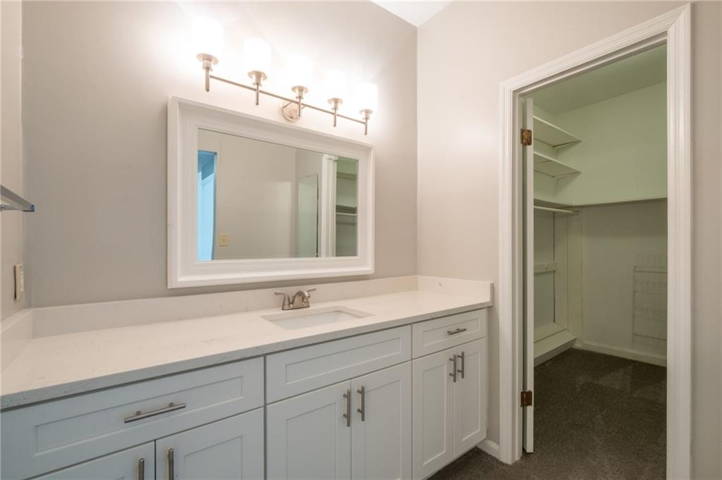 3817 Paces Ferry West Atlanta, GA 30339 - Photo 27 of 34 a bathroom with a sink and a mirror