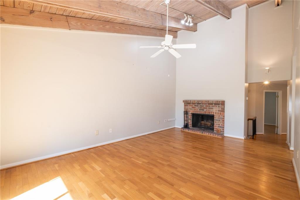 3817 Paces Ferry West Atlanta, GA 30339 - Photo 6 of 34 a view of empty room with wooden floor and fireplace