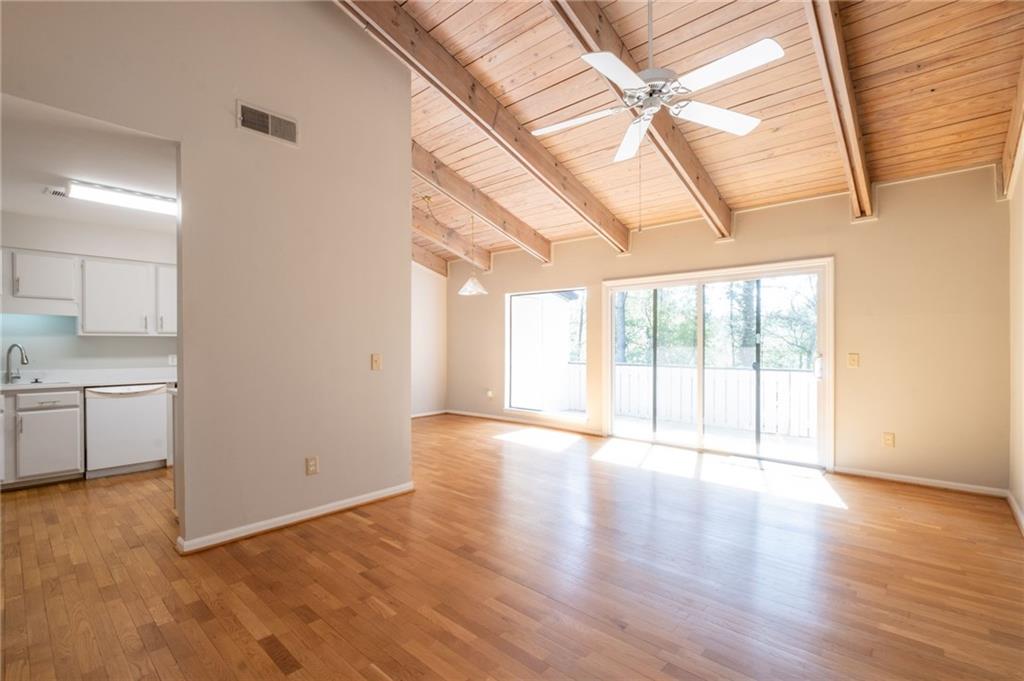 3817 Paces Ferry West Atlanta, GA 30339 - Photo 7 of 34 a view of an empty room with a window and wooden floor