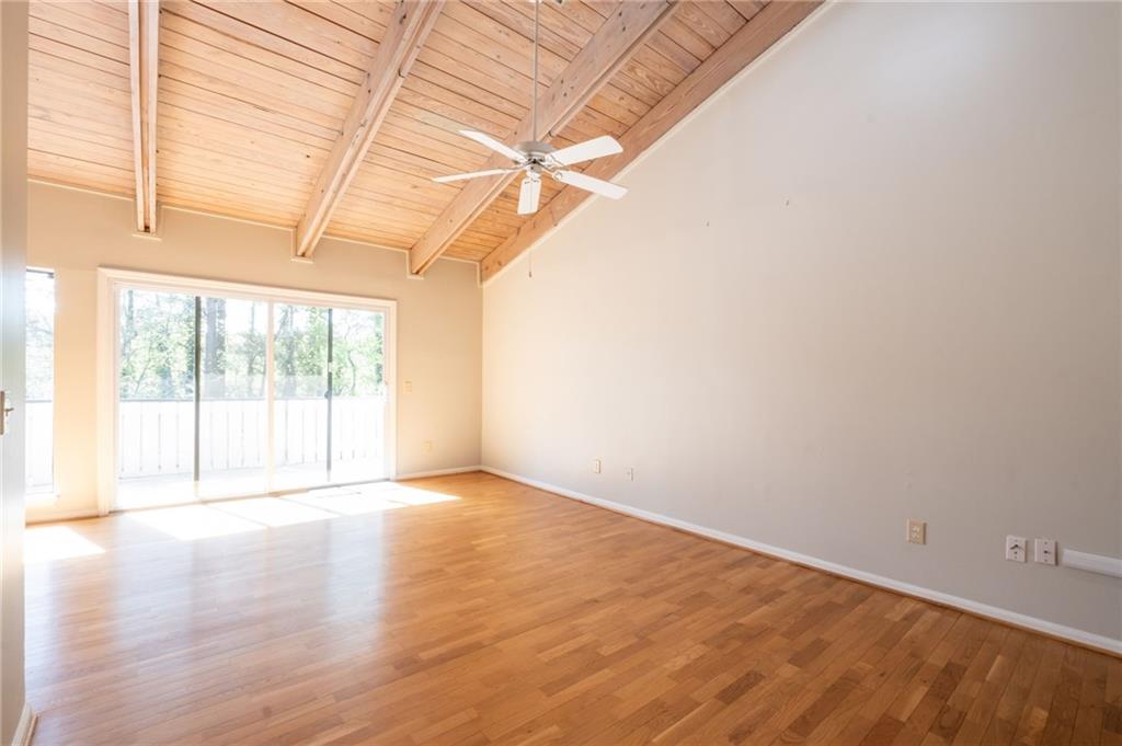 3817 Paces Ferry West Atlanta, GA 30339 - Photo 8 of 34 a view of an empty room with a window and wooden floor