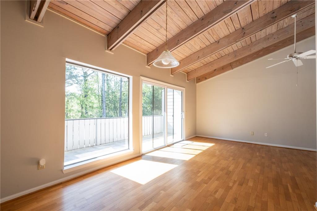 3817 Paces Ferry West Atlanta, GA 30339 - Photo 9 of 34 a view of an empty room with wooden floor and a window