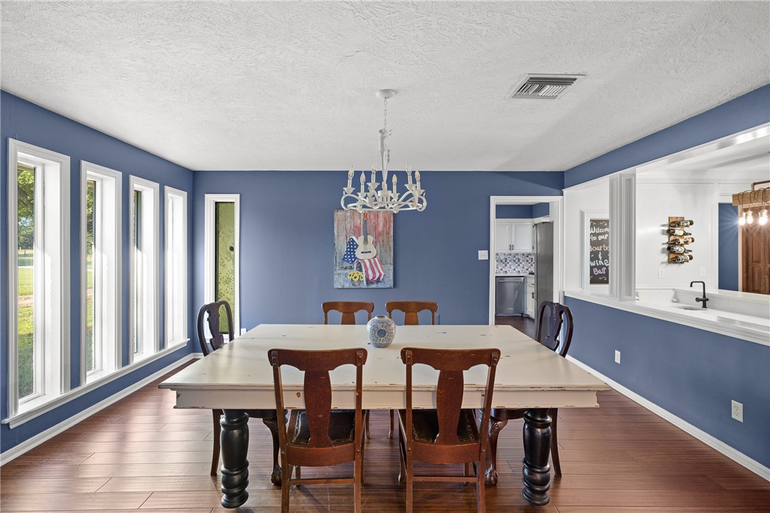 871 Cazey Loop Franklin, TX 77856 - Photo 8 of 42 a view of a dining room with furniture window and wooden floor