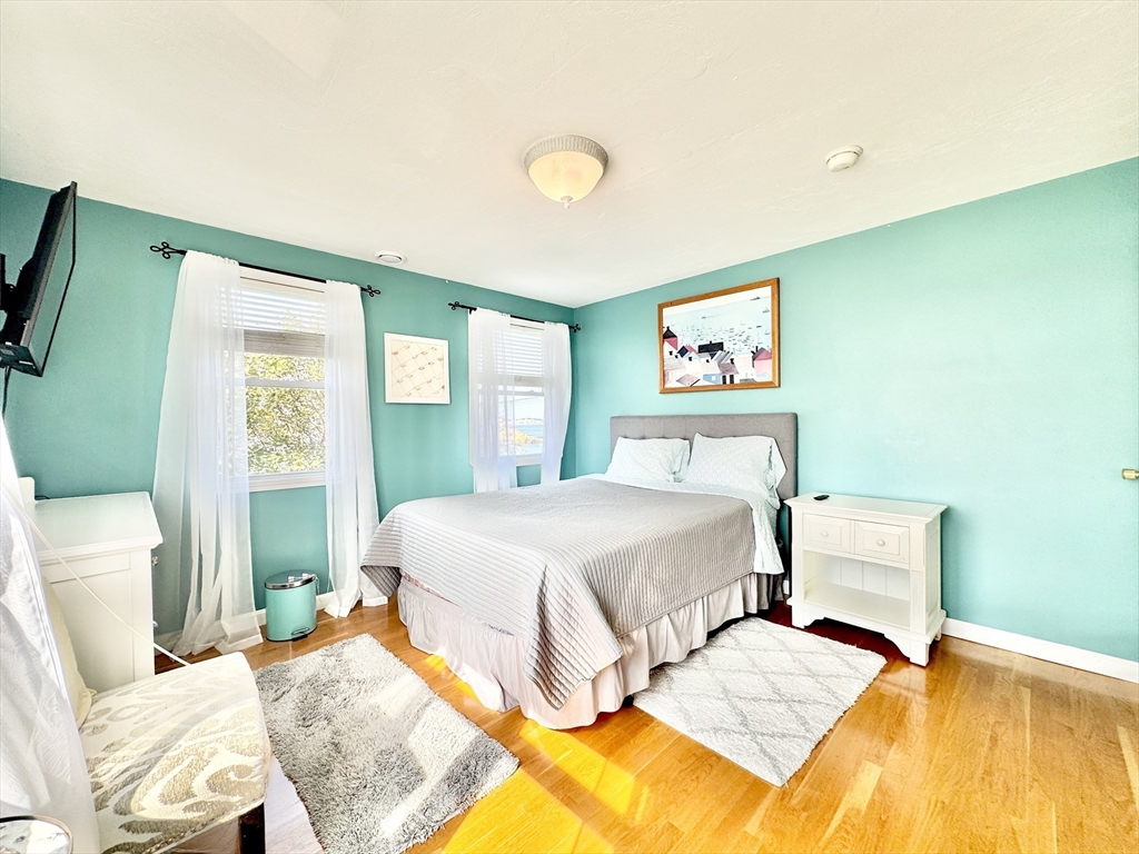 181 Atlantic Avenue Hull, MA 02045 - Photo 19 of 42 a bedroom with bed and a window