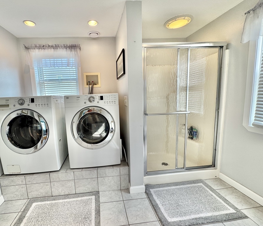 181 Atlantic Avenue Hull, MA 02045 - Photo 21 of 42 a view of a storage & utility room with washer and dryer