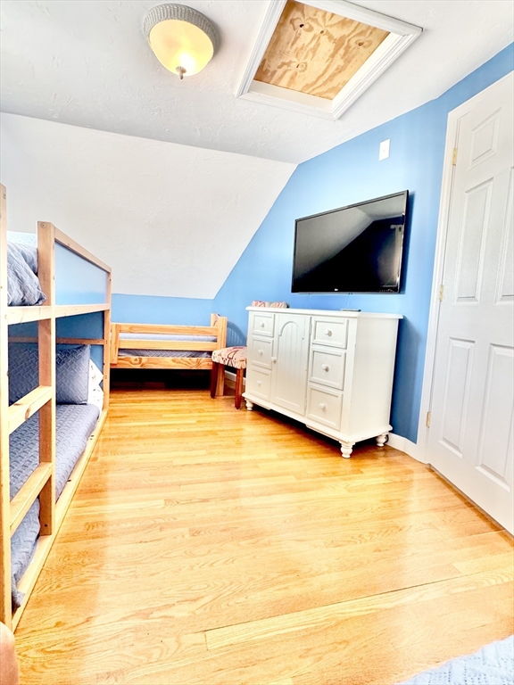 181 Atlantic Avenue Hull, MA 02045 - Photo 31 of 42 a living room with furniture and a flat screen tv