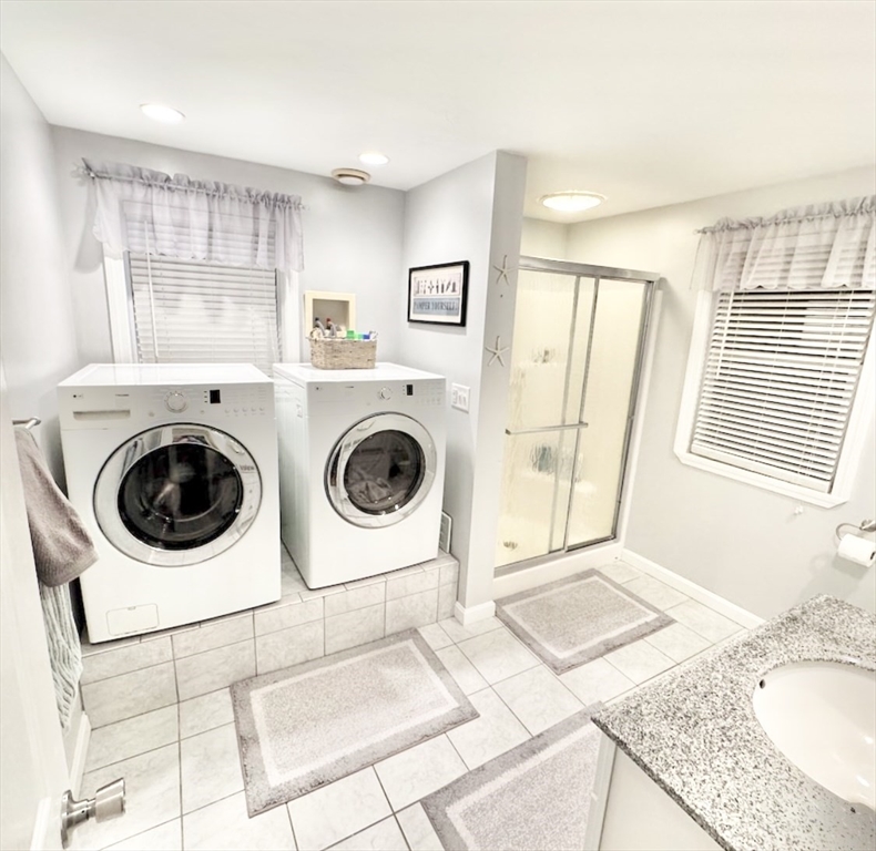 181 Atlantic Avenue Hull, MA 02045 - Photo 37 of 42 a view of a kitchen with washer and dryer