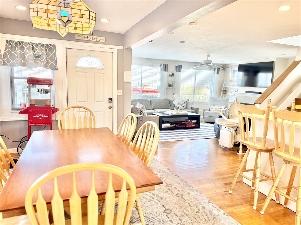 181 Atlantic Avenue Hull, MA 02045 - Photo 9 of 42 a living room with furniture and a chandelier
