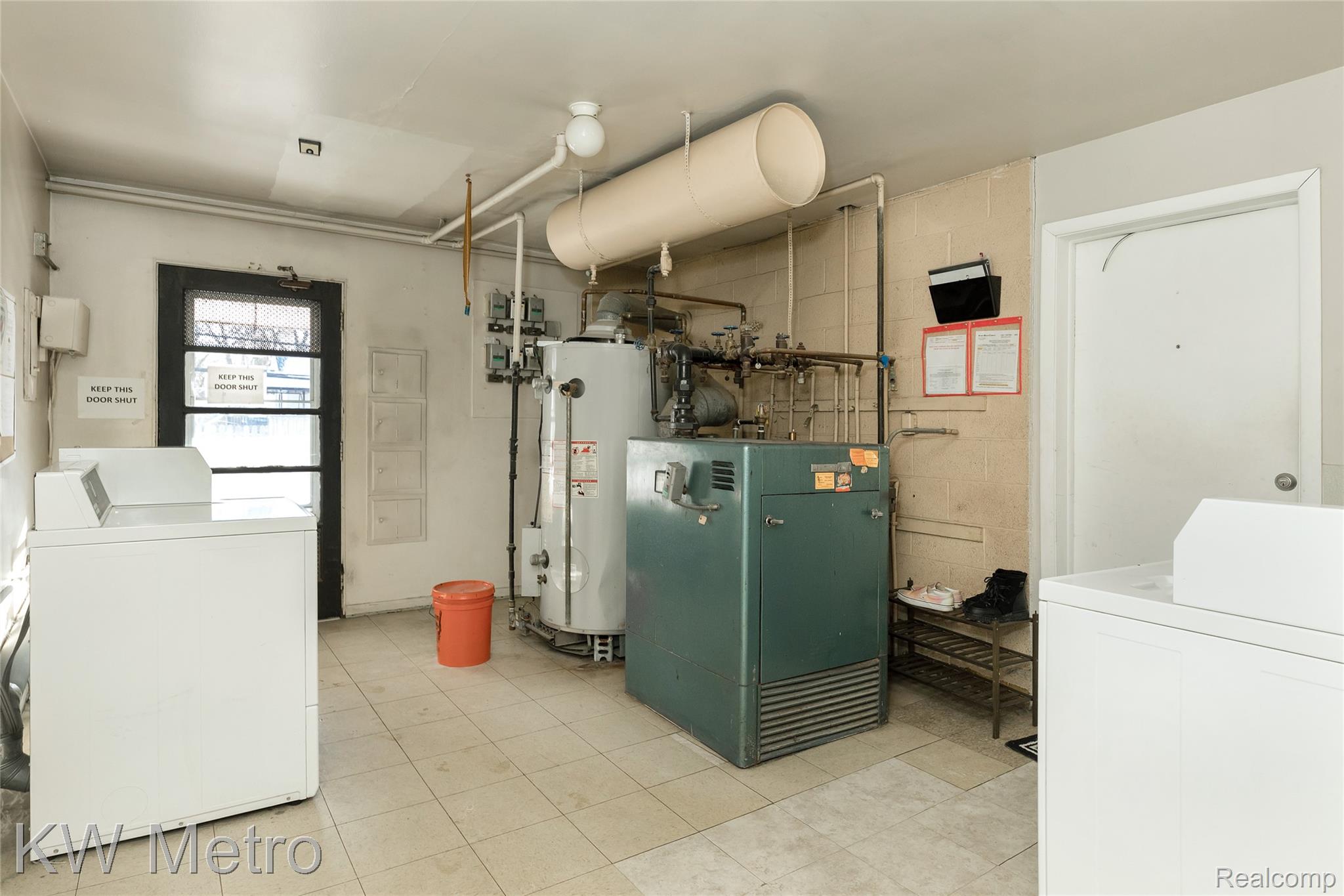 2817 West 13 Mile Road Royal Oak, MI 48073 - Photo 19 of 21 Utility room featuring water heater, washer and dryer, and a heating unit