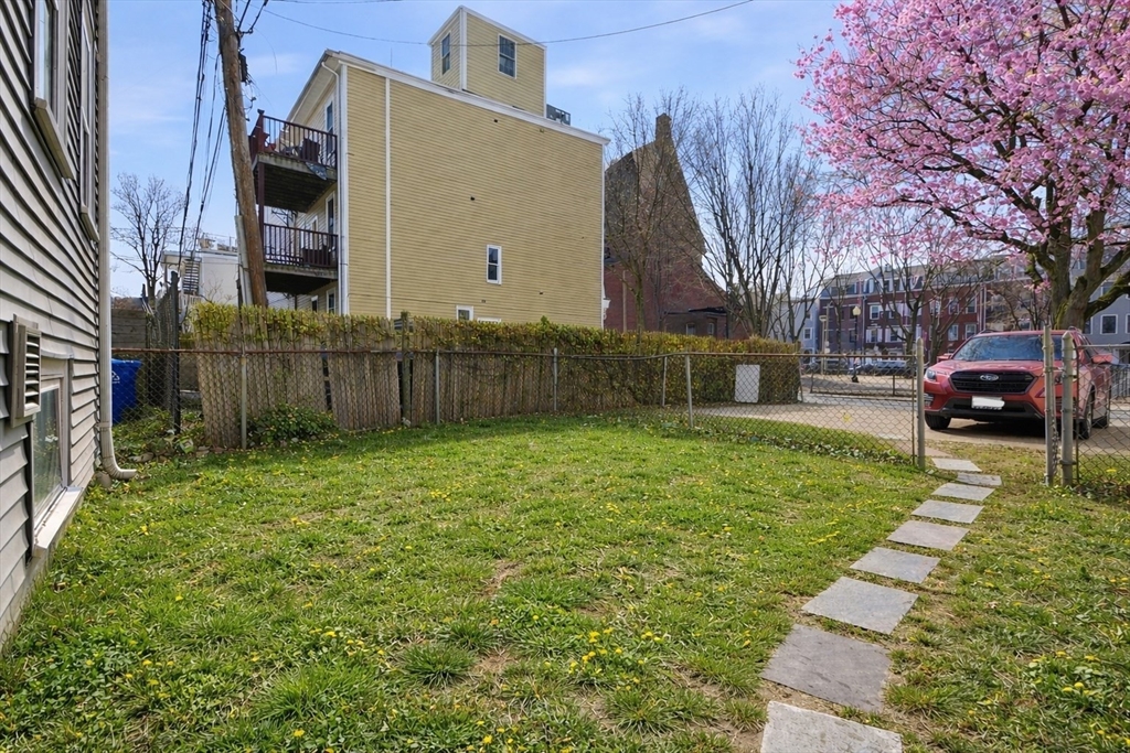 281 West 2nd Street, Unit A1 Boston, MA 02127 - Photo 14 of 17 a front view of a house with garden