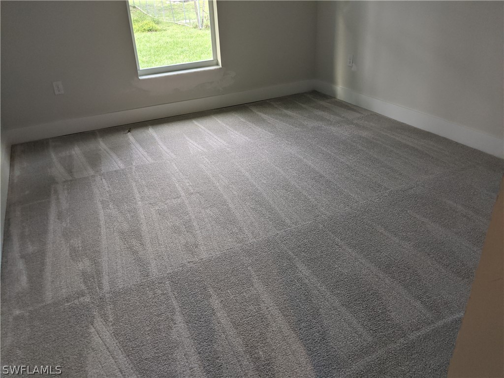 2930 18th Street Southwest Lehigh Acres, FL 33976 - Photo 13 of 20 an empty room with a window