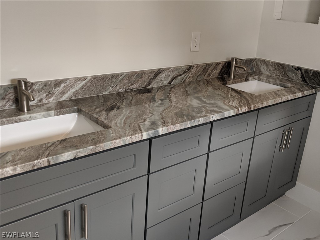 2930 18th Street Southwest Lehigh Acres, FL 33976 - Photo 5 of 20 a close view of sink and tap