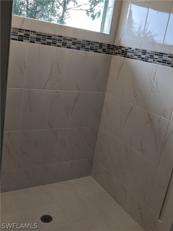 2930 18th Street Southwest Lehigh Acres, FL 33976 - Photo 8 of 20 a close view of a shower in a bathroom