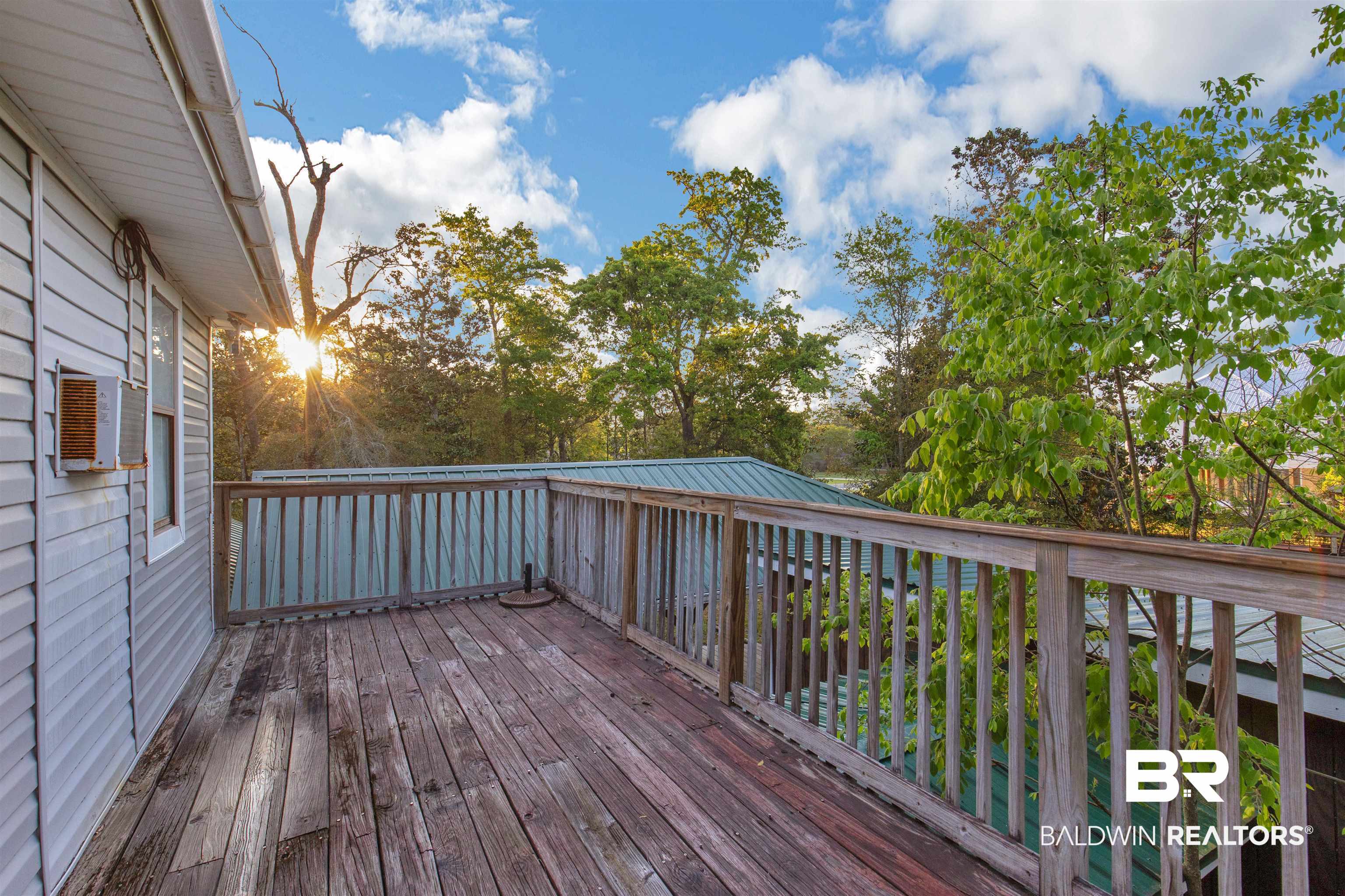 28290 Canal Road Orange Beach, AL 36561 - Photo 16 of 32 Wooden terrace with cooling unit