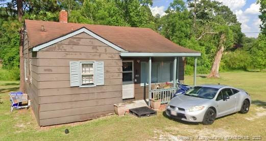 308 John Street Spring Lake, NC 28390 - Photo 1 of 3 a front view of a house with a yard