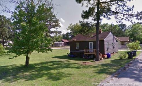 308 John Street Spring Lake, NC 28390 - Photo 3 of 3 a front view of a house with a yard