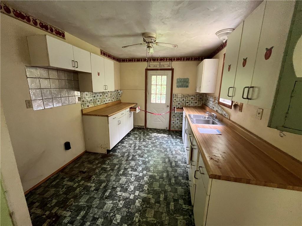 90 Grandview Avenue Indiana, PA 15701 - Photo 16 of 20 a kitchen with stainless steel appliances granite countertop a sink stove and refrigerator