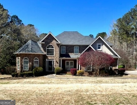 2973 Red Fox Drive Haddock, GA 31033 - Photo 1 of 34 a front view of a house with a yard