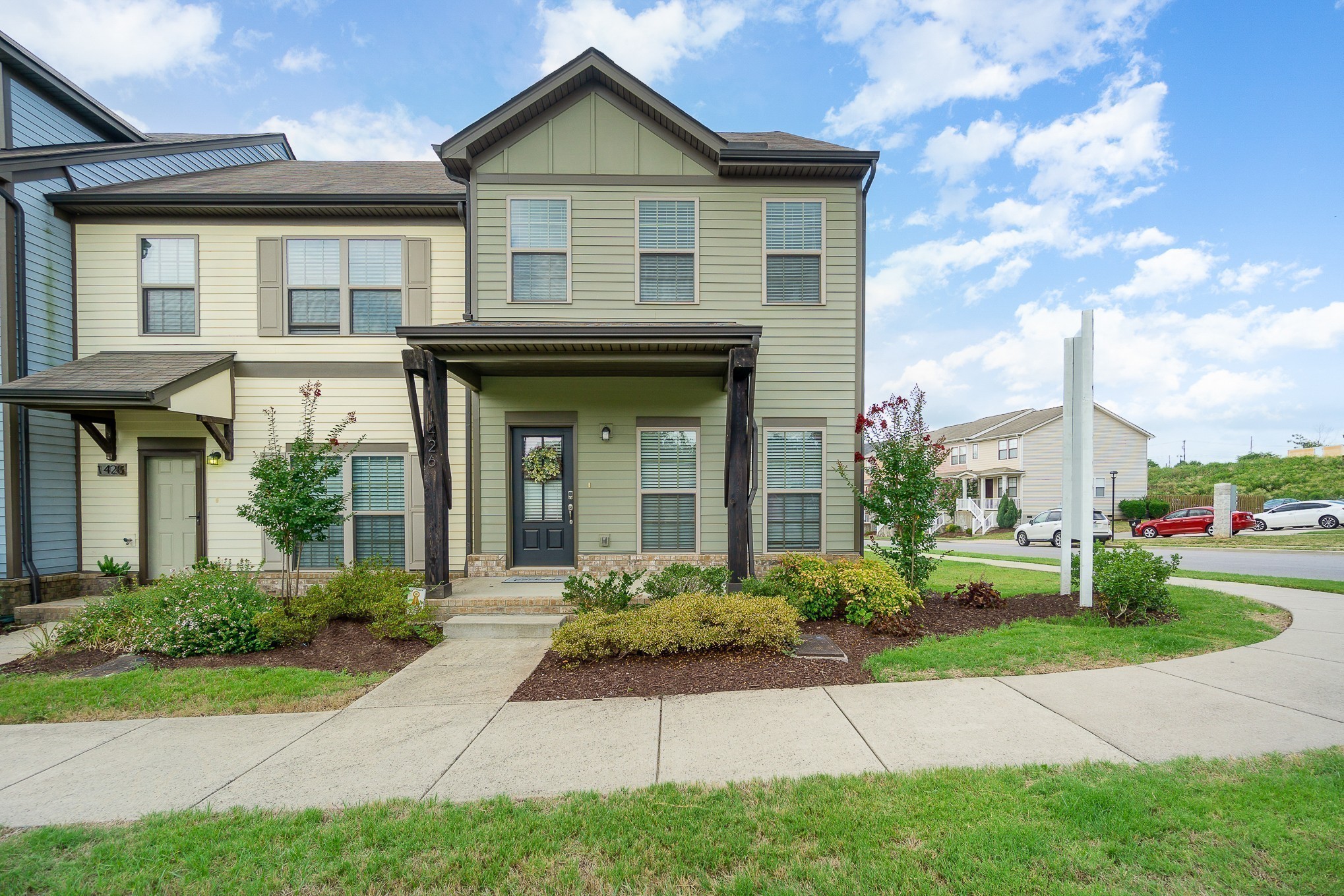 a front view of a house with a yard