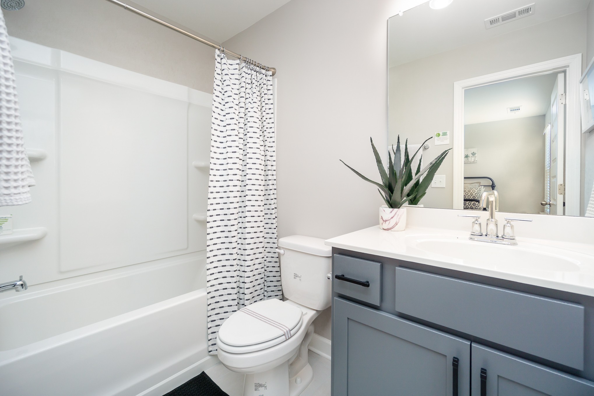 1744 Fenway Loop Antioch, TN 37013 - Photo 28 of 38 a bathroom with a sink a toilet a mirror and shower