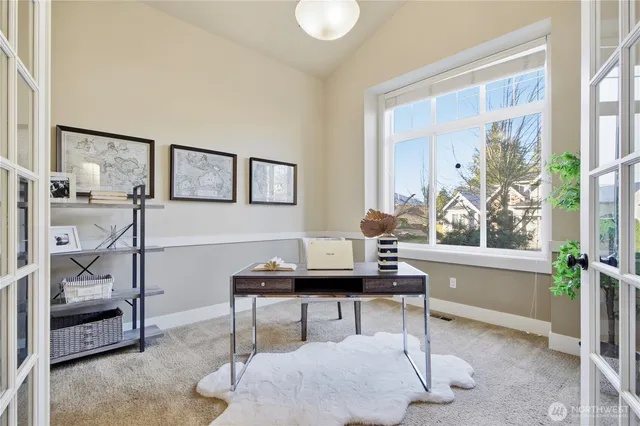 a workspace with furniture and window