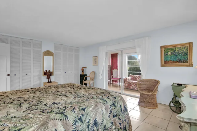 a bed room with a bed and a window