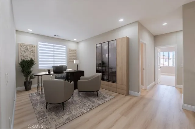 a living room with furniture window and wooden floor