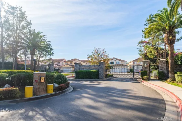 a view of a town with palm trees