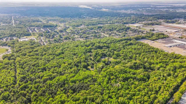 an aerial view of residential house and outdoor space