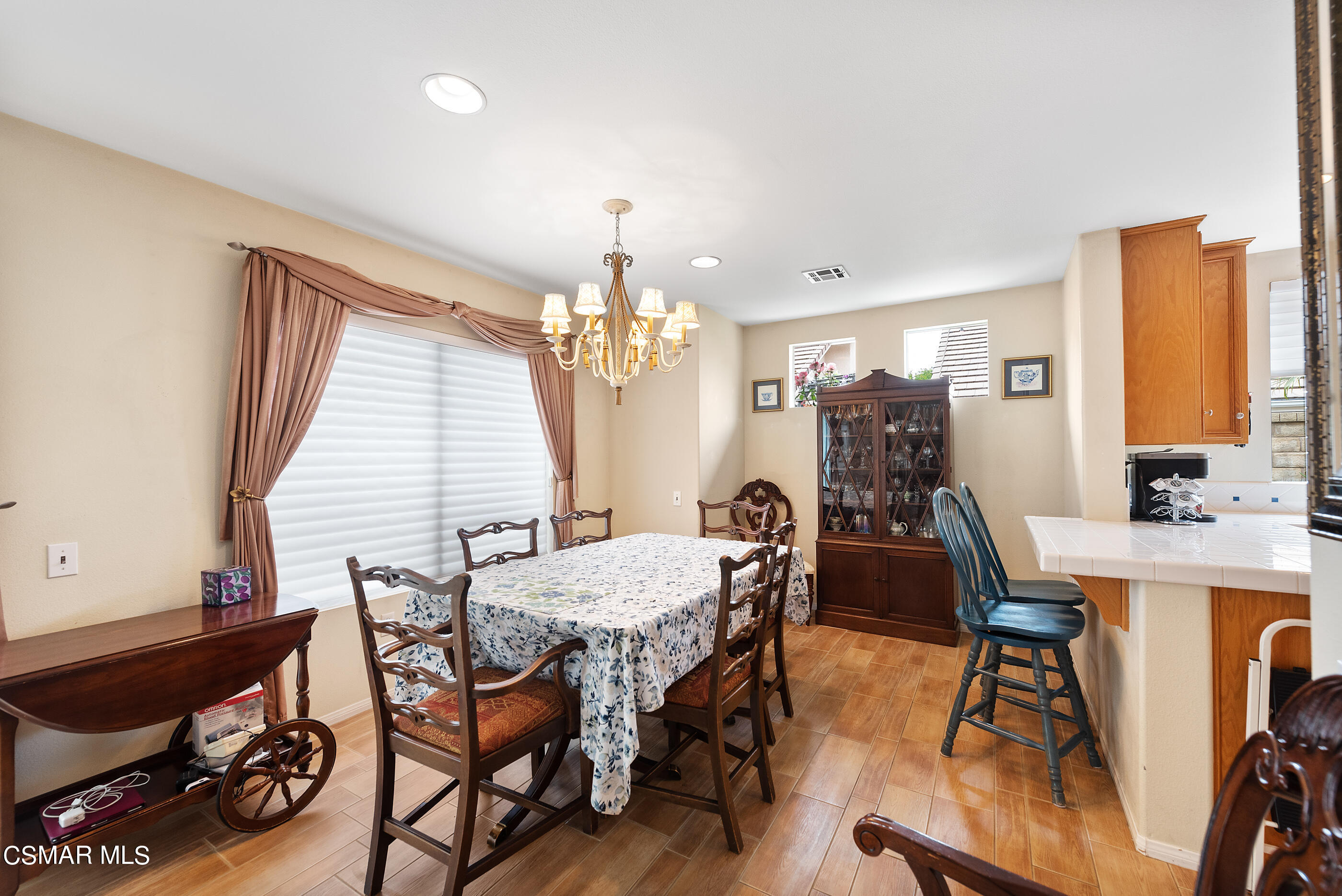 5642 Daisy Street Simi Valley, CA 93063 - Photo 11 of 41 a view of a dining room with furniture and chandelier