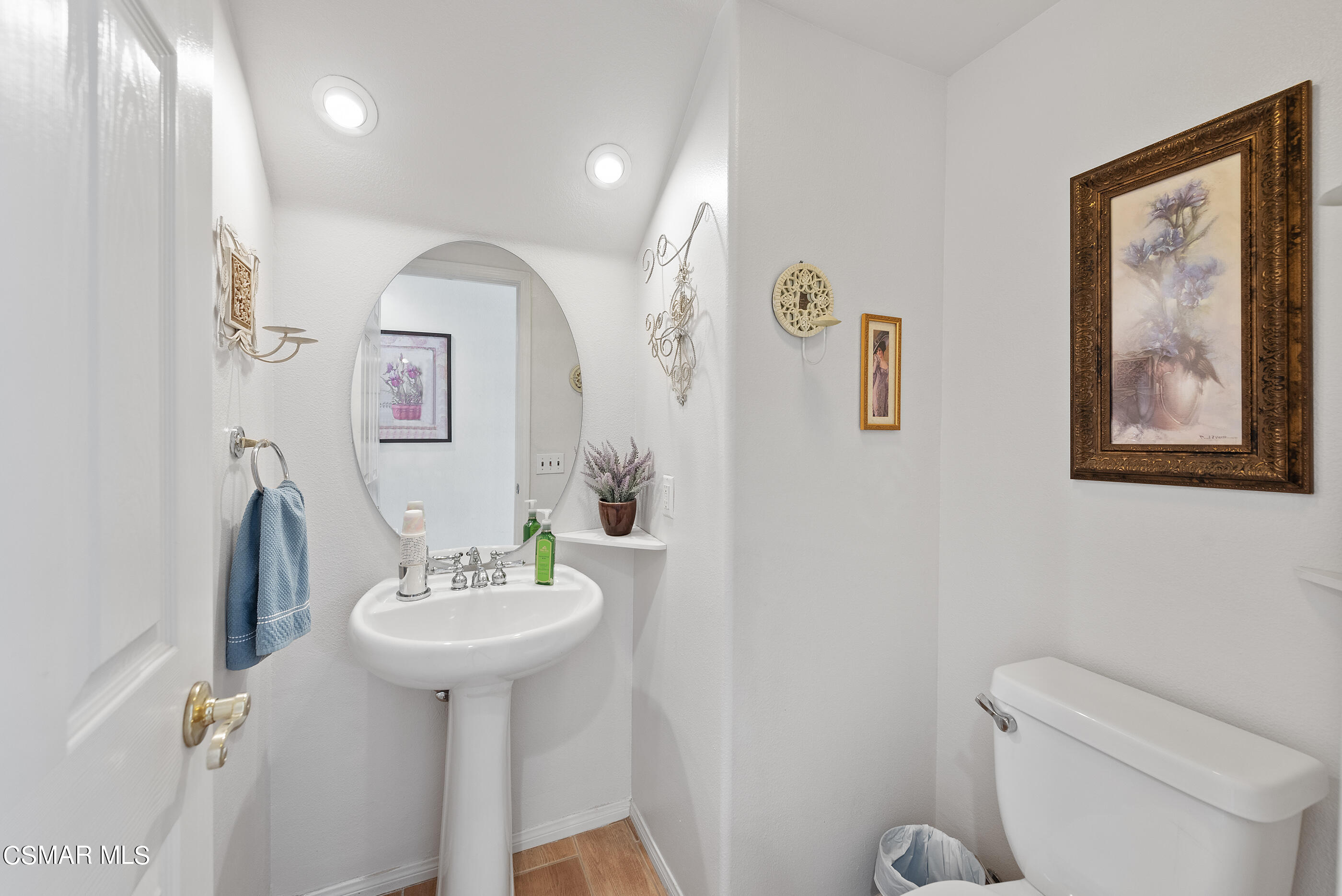 5642 Daisy Street Simi Valley, CA 93063 - Photo 18 of 41 a bathroom with a toilet sink and mirror