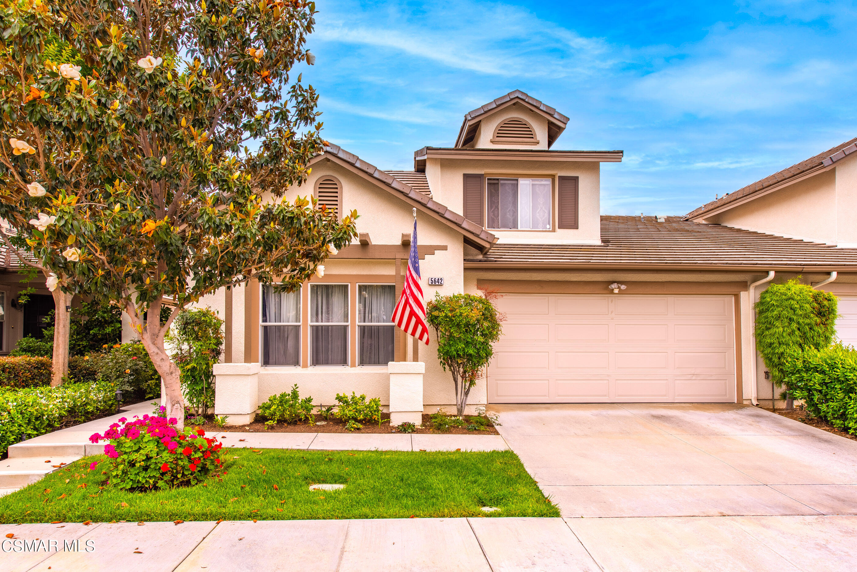 5642 Daisy Street Simi Valley, CA 93063 - Photo 2 of 41 a front view of a house with a garden and plants