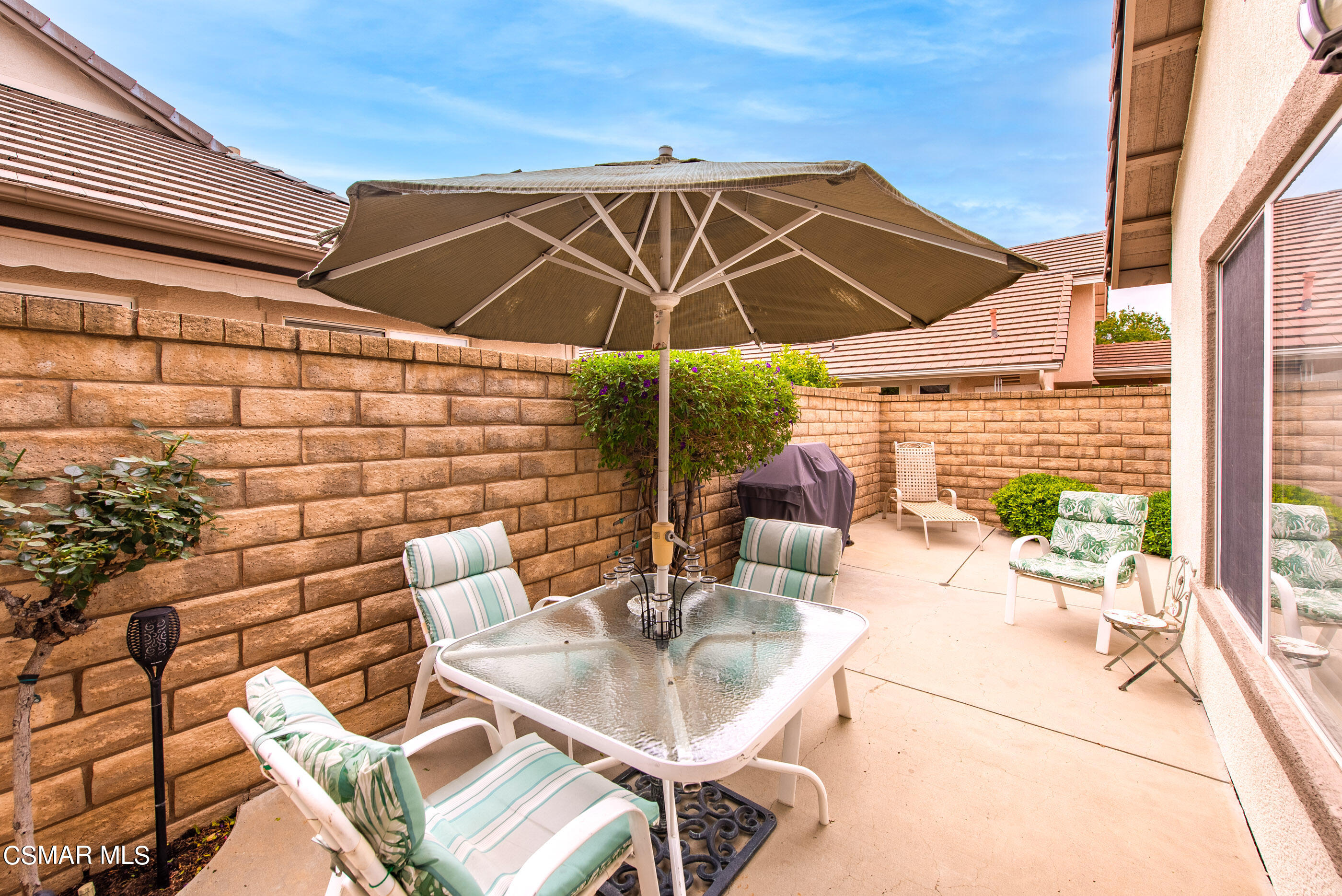 5642 Daisy Street Simi Valley, CA 93063 - Photo 30 of 41 a patio with a table and chairs